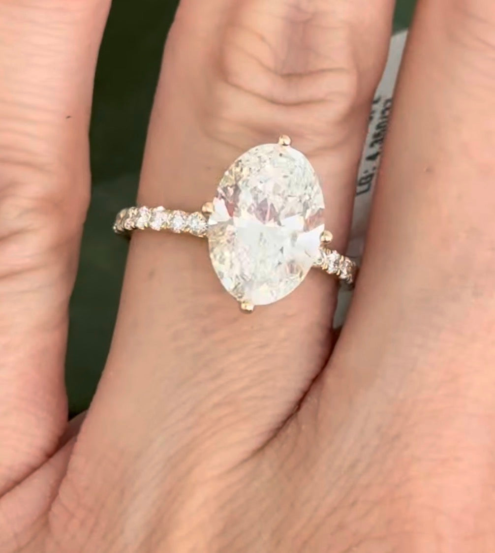 IGI certified yellow gold oval and round lab diamond ring. Center stone is 3.82cts