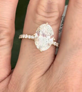 IGI certified yellow gold oval and round lab diamond ring. Center stone is 3.82cts