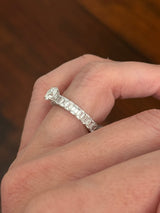 White gold 1.06ct round lab diamond and 4.14ct emerald cut lab diamond eternity ring