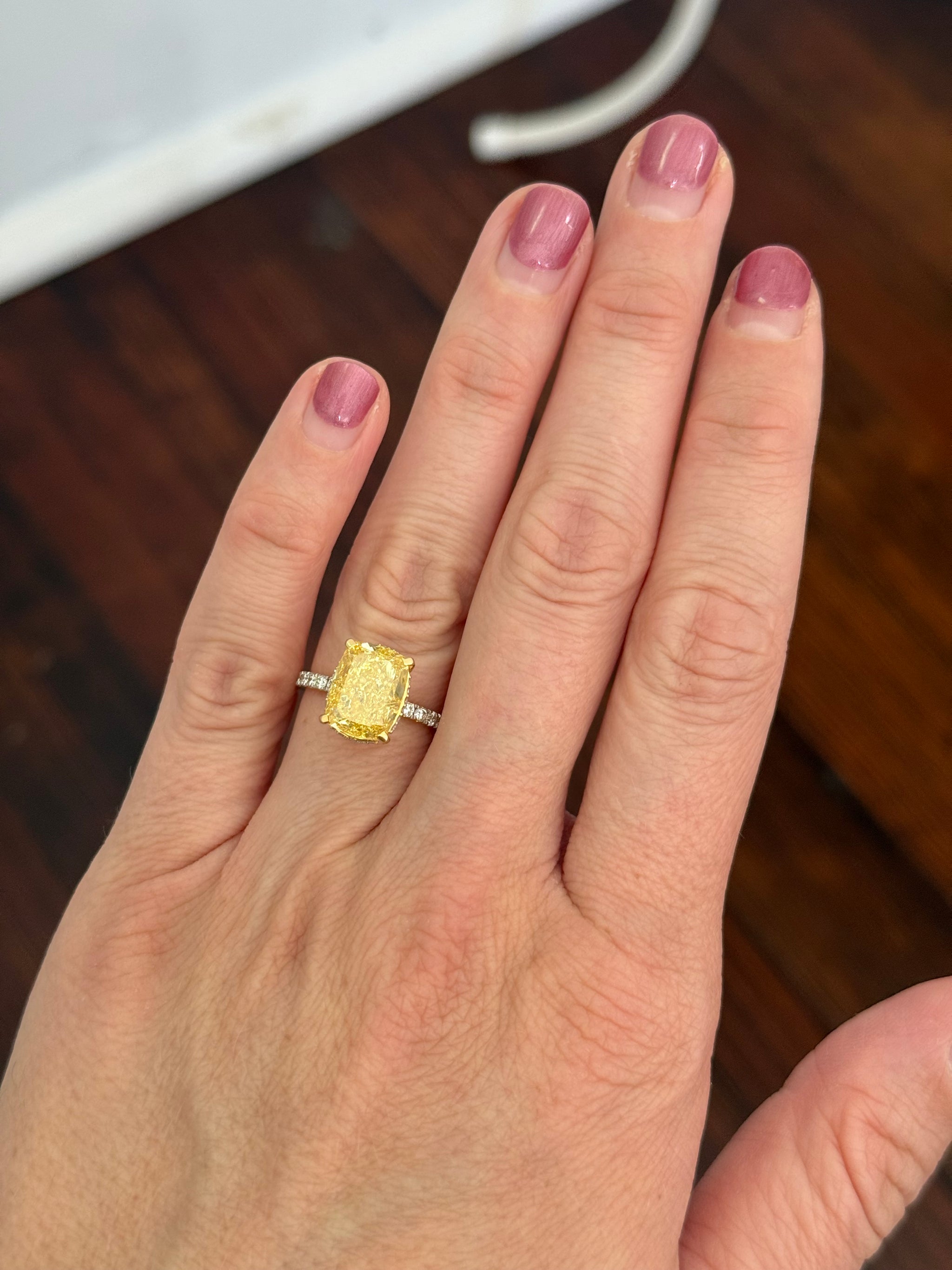 Yellow gold elongated cushion cut yellow lab diamond and white lab diamond ring