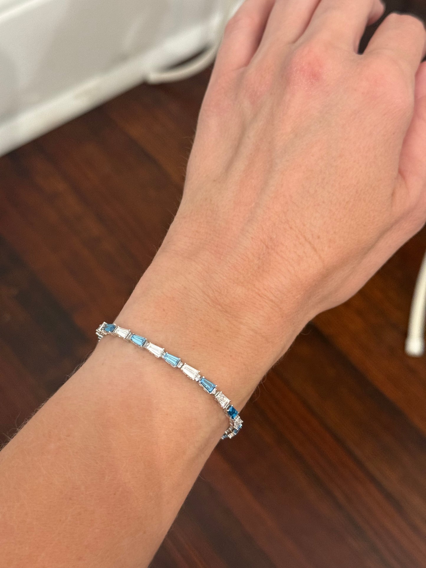 White gold 5.91ct tapered baguette blue and white lab diamond bracelet
