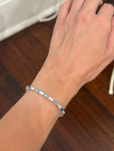 White gold 5.91ct tapered baguette blue and white lab diamond bracelet