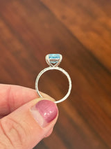 White gold radiant blue lab diamond and white lab diamond ring