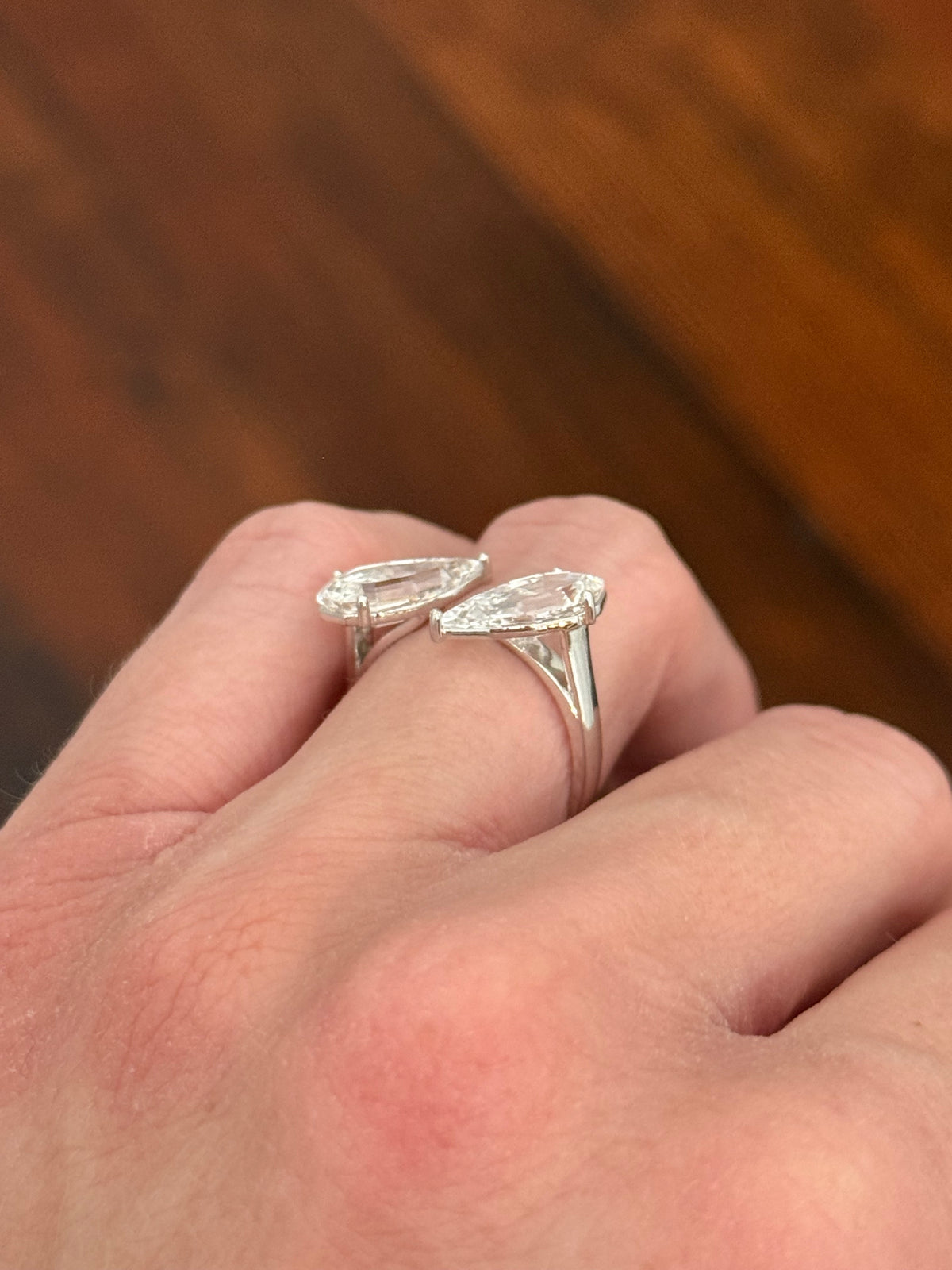 White gold 4.38ct step cut pear lab diamond bypass ring. Each measures 12.78x6.10mm