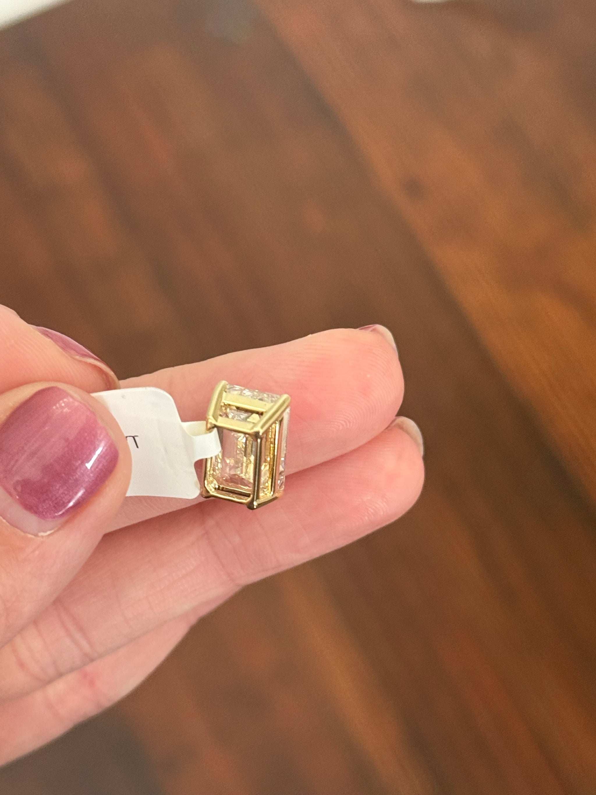 Yellow gold IGI certified 6.09ct emerald cut lab diamond pendant. Can be worn either east west or north south.
