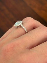 White gold oval blue lab diamond and white lab diamond ring