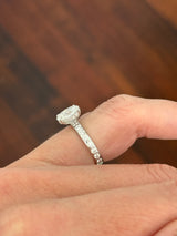White gold oval and round lab diamond ring. Center stone is 1ct and 8.5x6mm