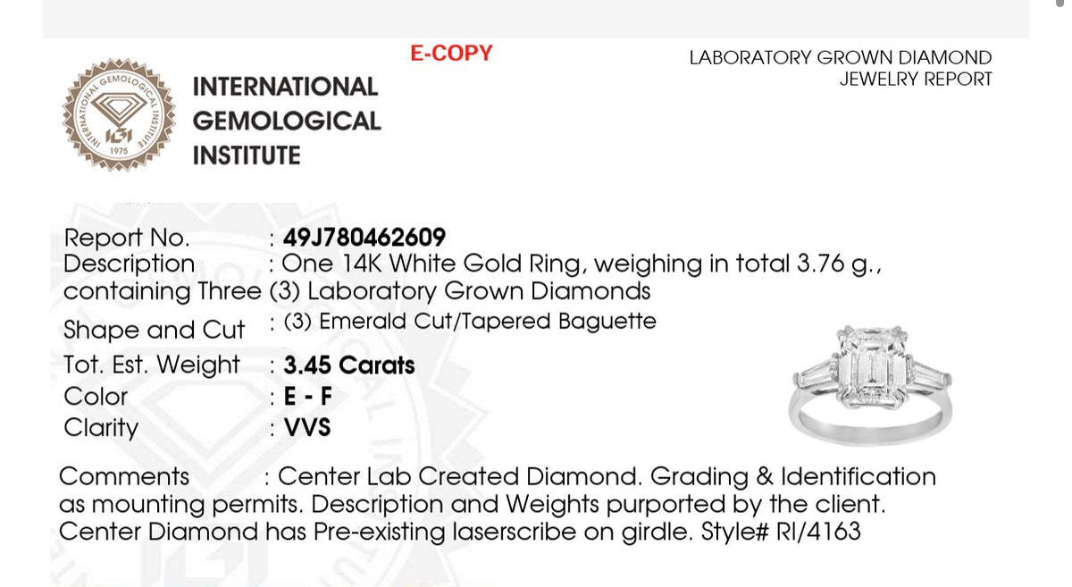 White gold IGI certified emerald cut and tapered baguette lab diamond ring. Center stone is 3.06cts