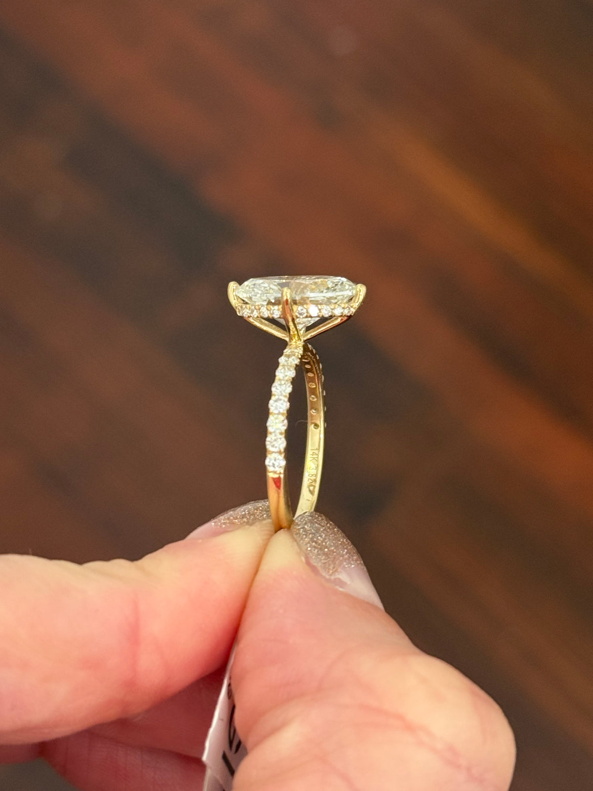 IGI certified yellow gold oval and round lab diamond ring. Center stone is 3.82cts