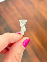 White gold oval, marquise and round lab diamond ring. Center stone is 3.07cts