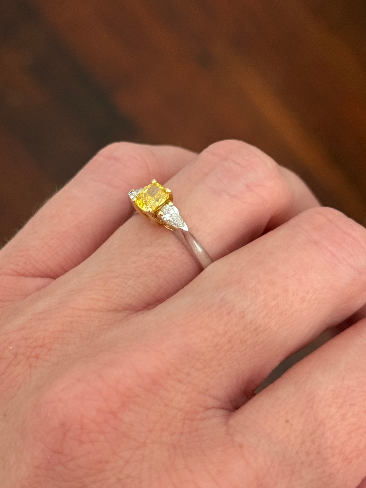 White gold cushion cut yellow lab diamond and pear shape white lab diamond ring. Lab diamonds set in yellow gold.