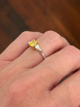 White gold cushion cut yellow lab diamond and pear shape white lab diamond ring. Lab diamonds set in yellow gold.