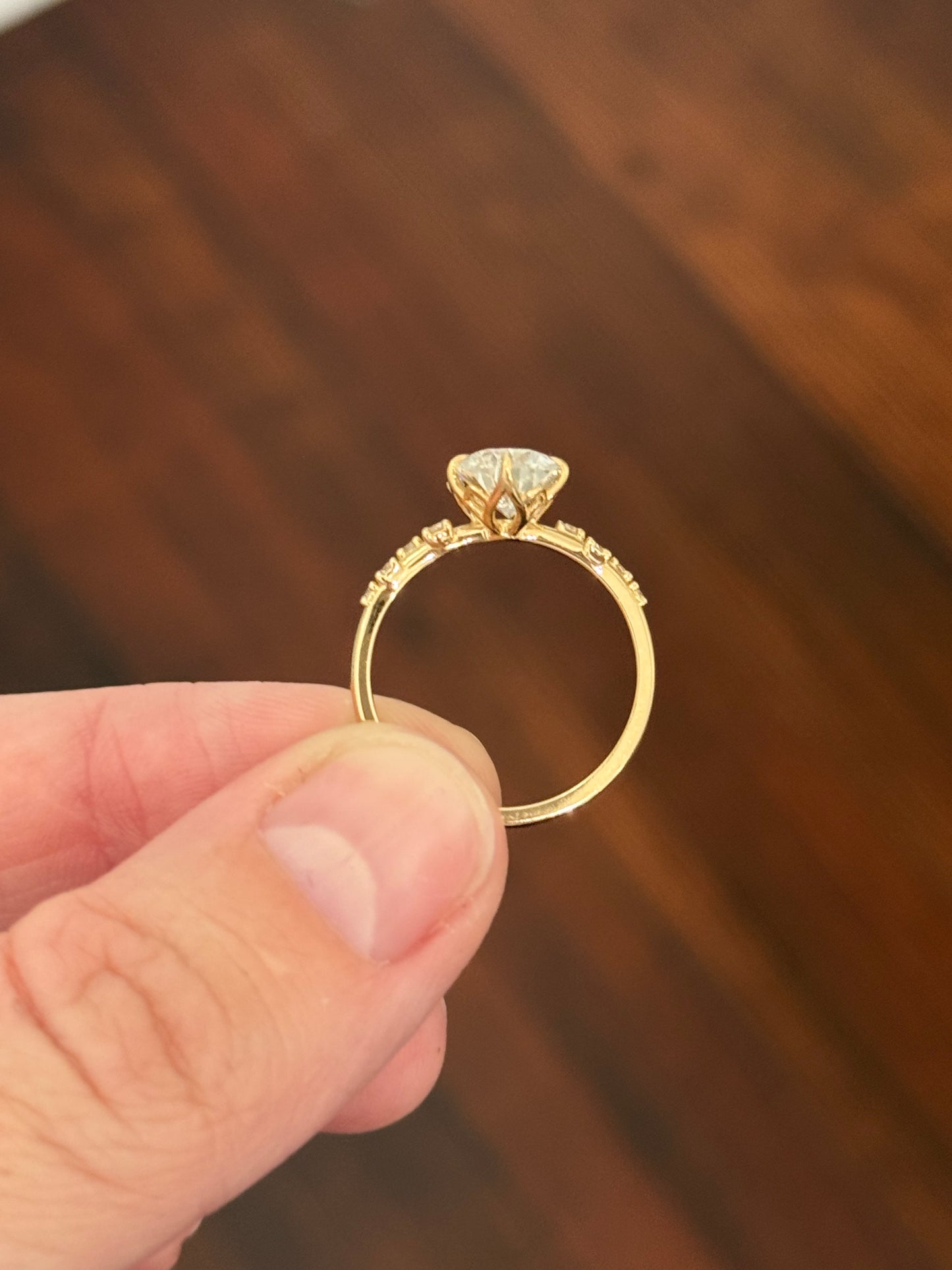 Yellow gold pear shape and round lab diamond ring