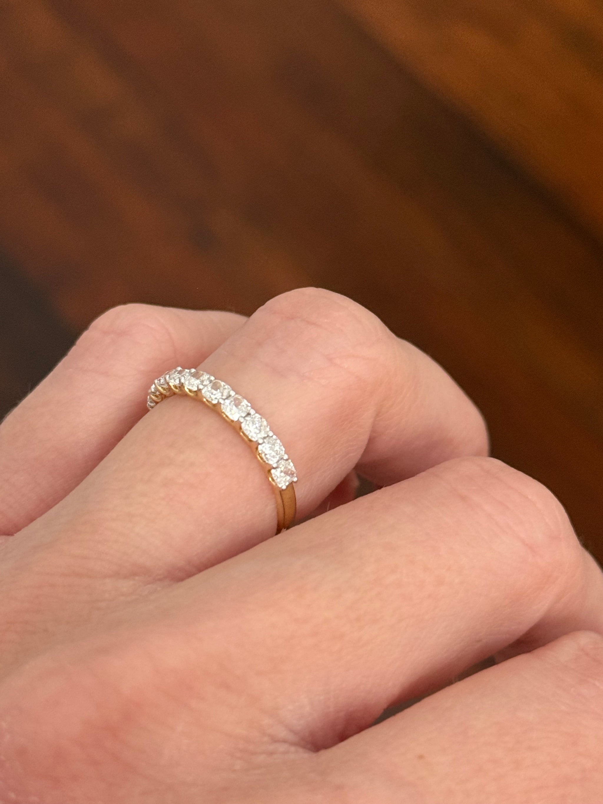 Yellow gold cushion cut lab diamond band. Prongs are white gold.