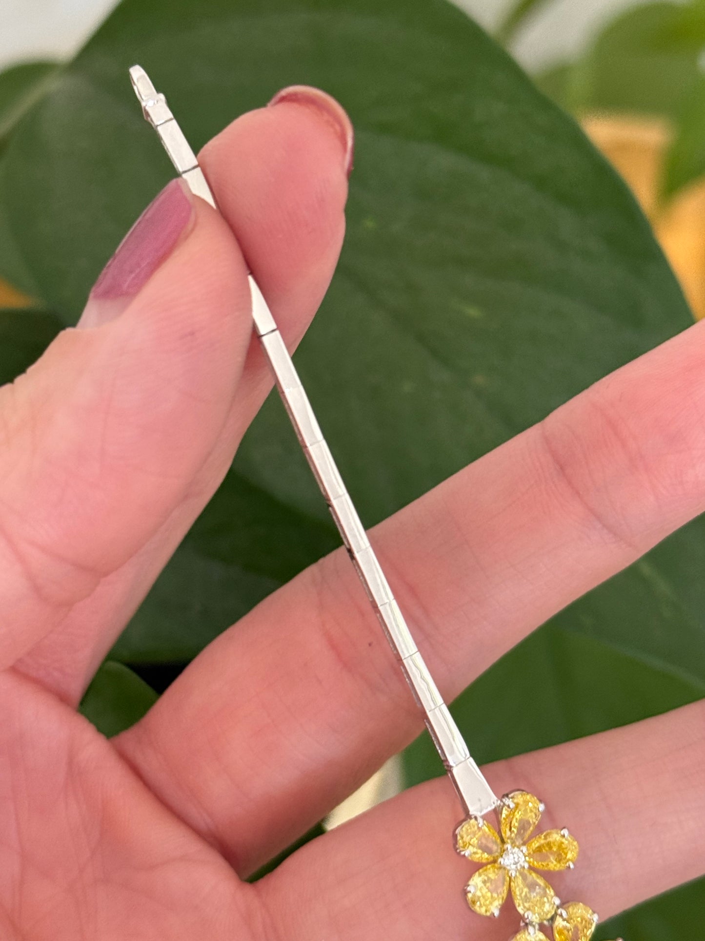 White gold flower bracelet with pear shaped yellow lab diamonds and round white lab diamonds
