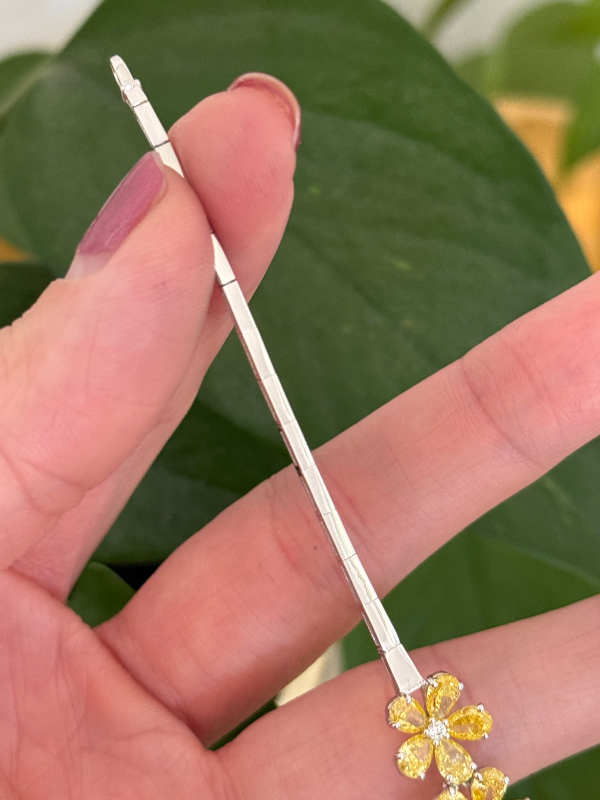 White gold flower bracelet with pear shaped yellow lab diamonds and round white lab diamonds