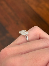 White gold 3.15ct step cut pear shape lab diamond bypass ring. Each measures 10.45x5.70mm
