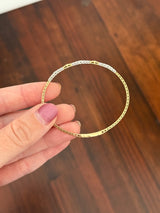 Yellow gold lab diamond flex bracelet. Lab diamonds are set in white gold.