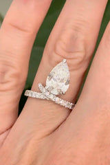 White gold pear shape and round lab diamond ring. Center stone is 3.08cts