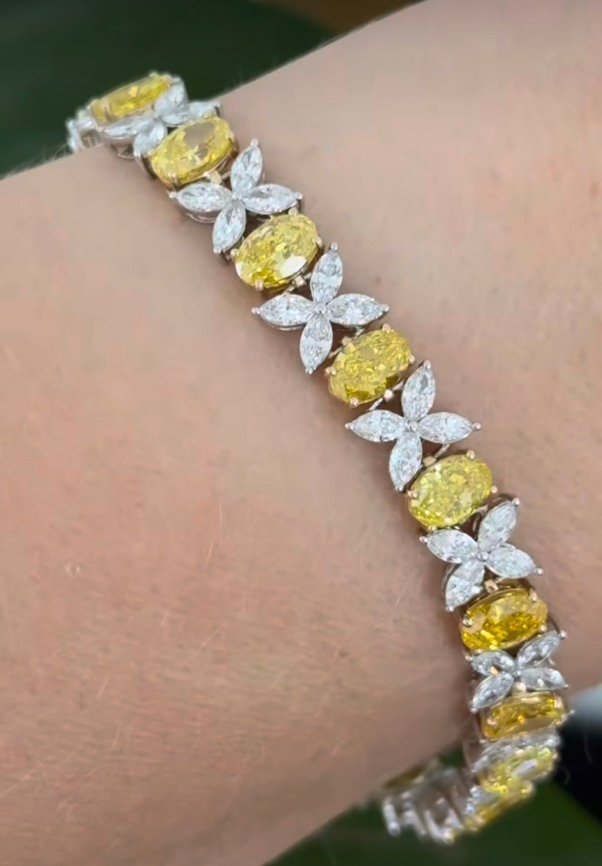 Yellow and white gold oval yellow lab diamond and marquise white lab diamond bracelet. Yellow lab diamonds are set in yellow gold and white lab diamonds are set in white gold.