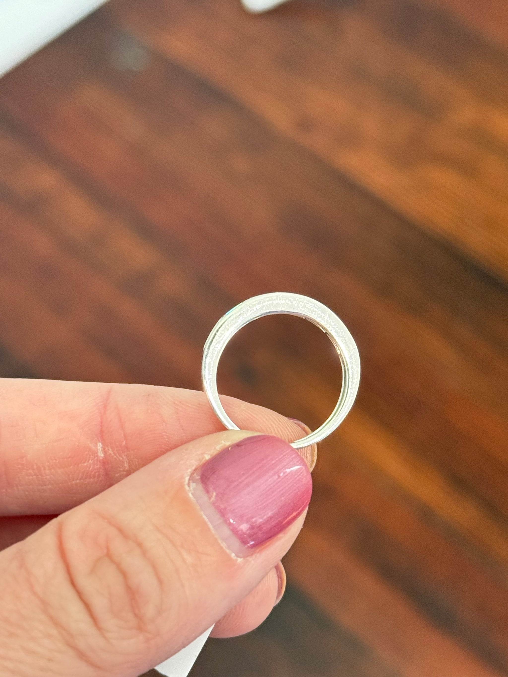 White gold east west set emerald cut lab diamond band