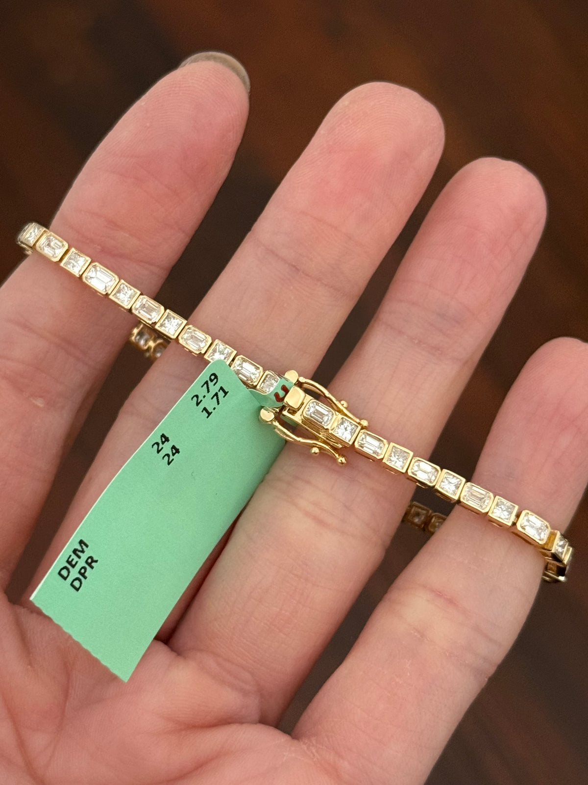 Yellow gold bezel and east west set 4.5ct emerald and princess cut natural diamond bracelet