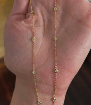 Yellow gold round lab diamond necklace with 4 bezel set lab diamond on either side of chain