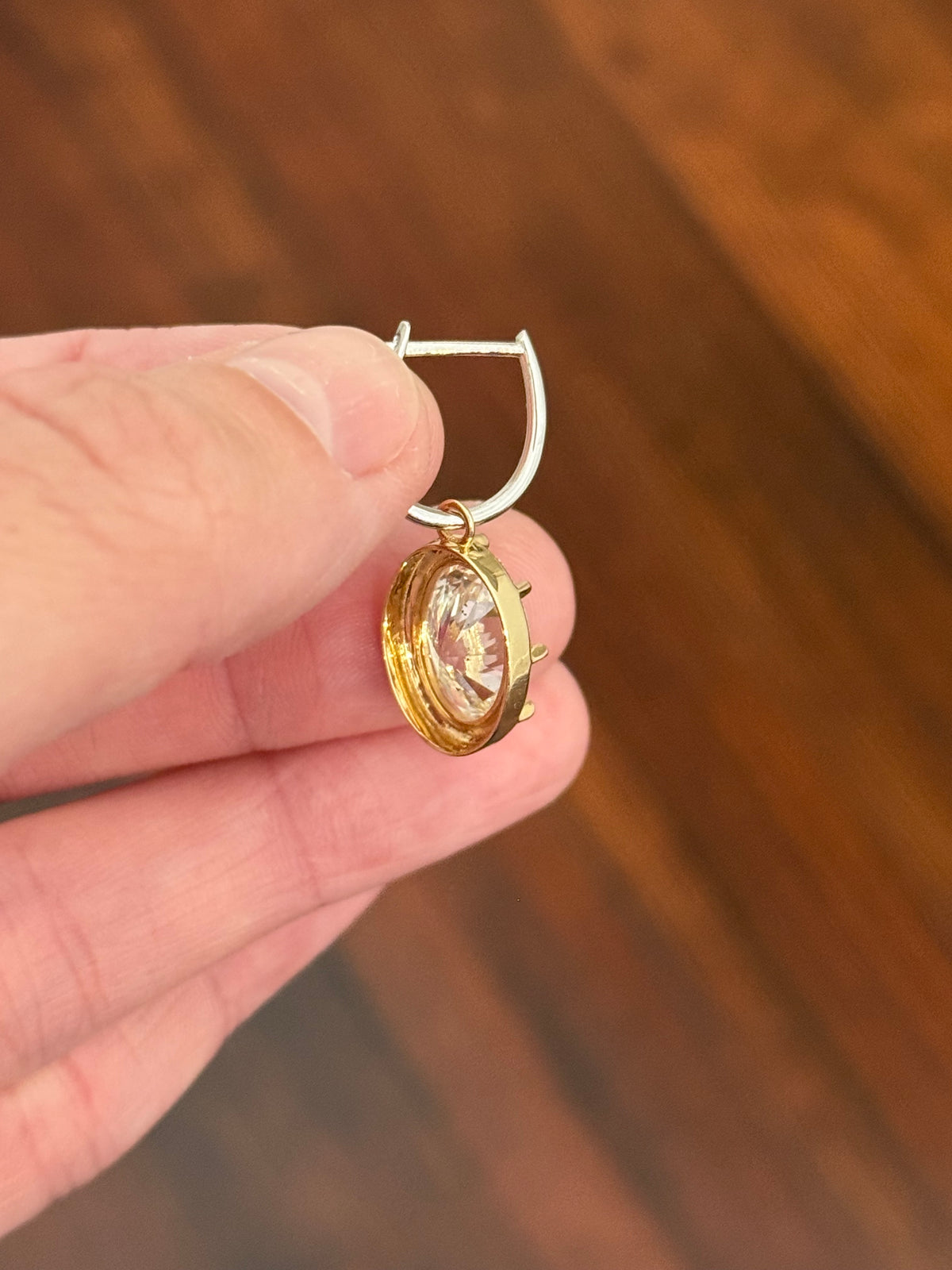 Oval lab diamond latch back earrings. Lab diamonds are set in yellow gold and earrings are white gold.