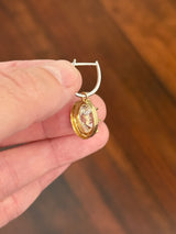 Oval lab diamond latch back earrings. Lab diamonds are set in yellow gold and earrings are white gold.