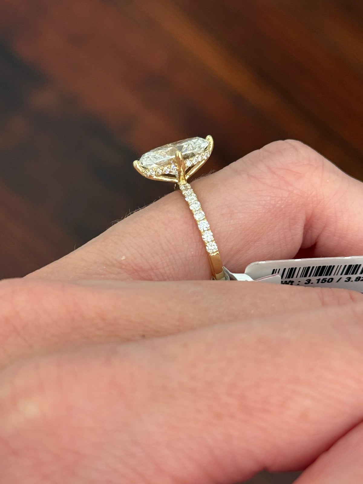 IGI certified yellow gold oval and round lab diamond ring. Center stone is 3.82cts