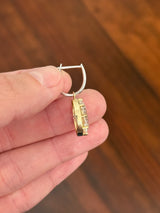 Oval lab diamond latch back earrings. Lab diamonds are set in yellow gold and earrings are white gold.
