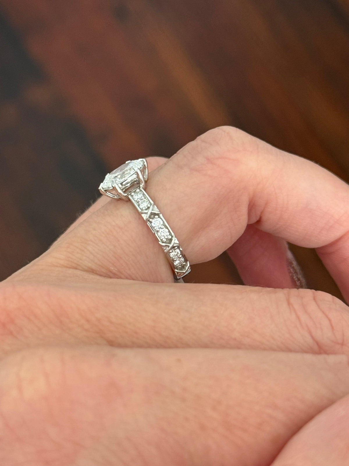 White gold oval and round lab diamond ring. Center stone is 1ct and approximately 8.5x5.5mm