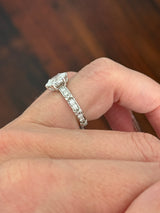 White gold oval and round lab diamond ring. Center stone is 1ct and approximately 8.5x5.5mm