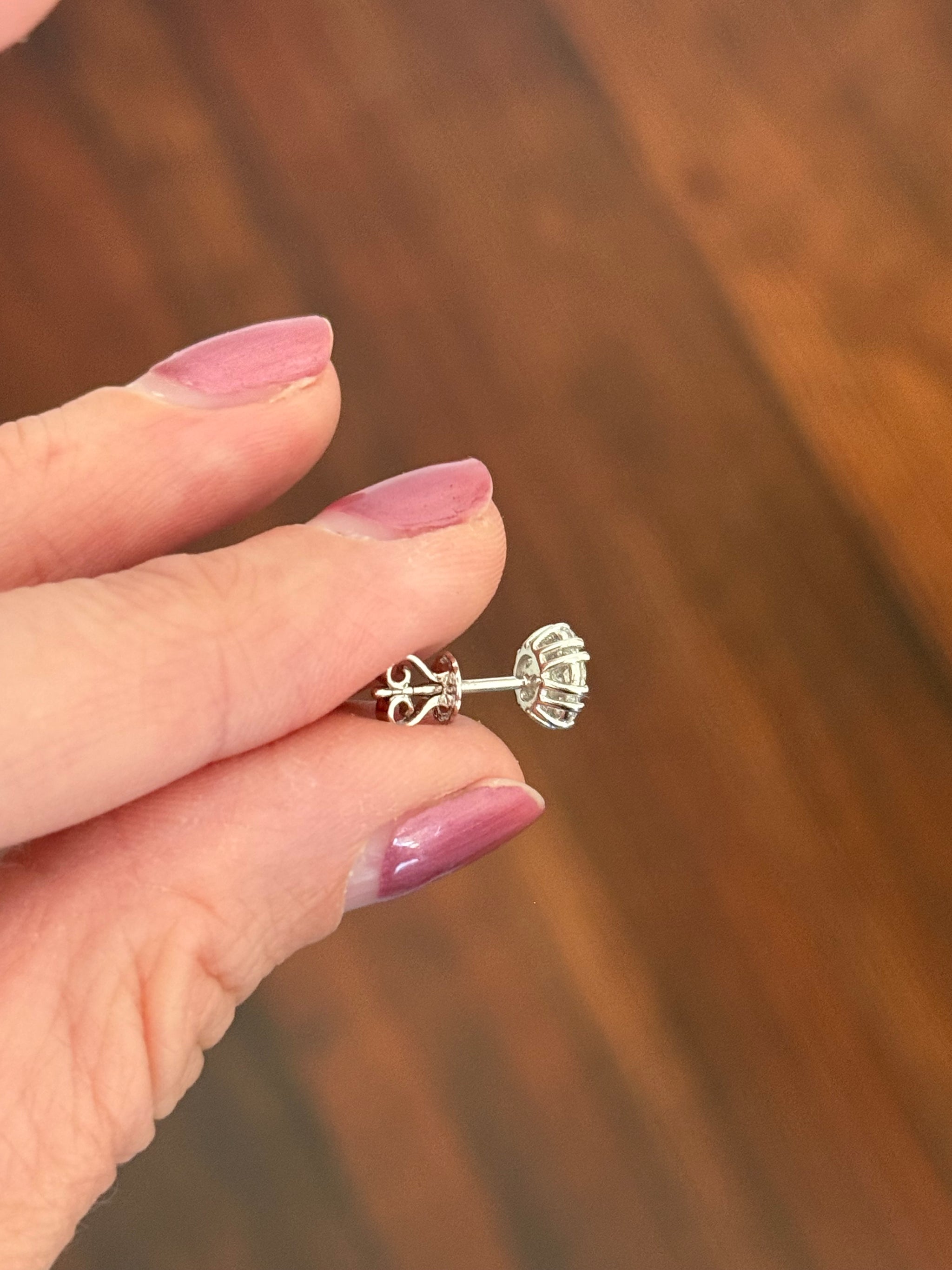 White gold 0.65ct lab diamond flower studs with push backs. Two pairs available.
