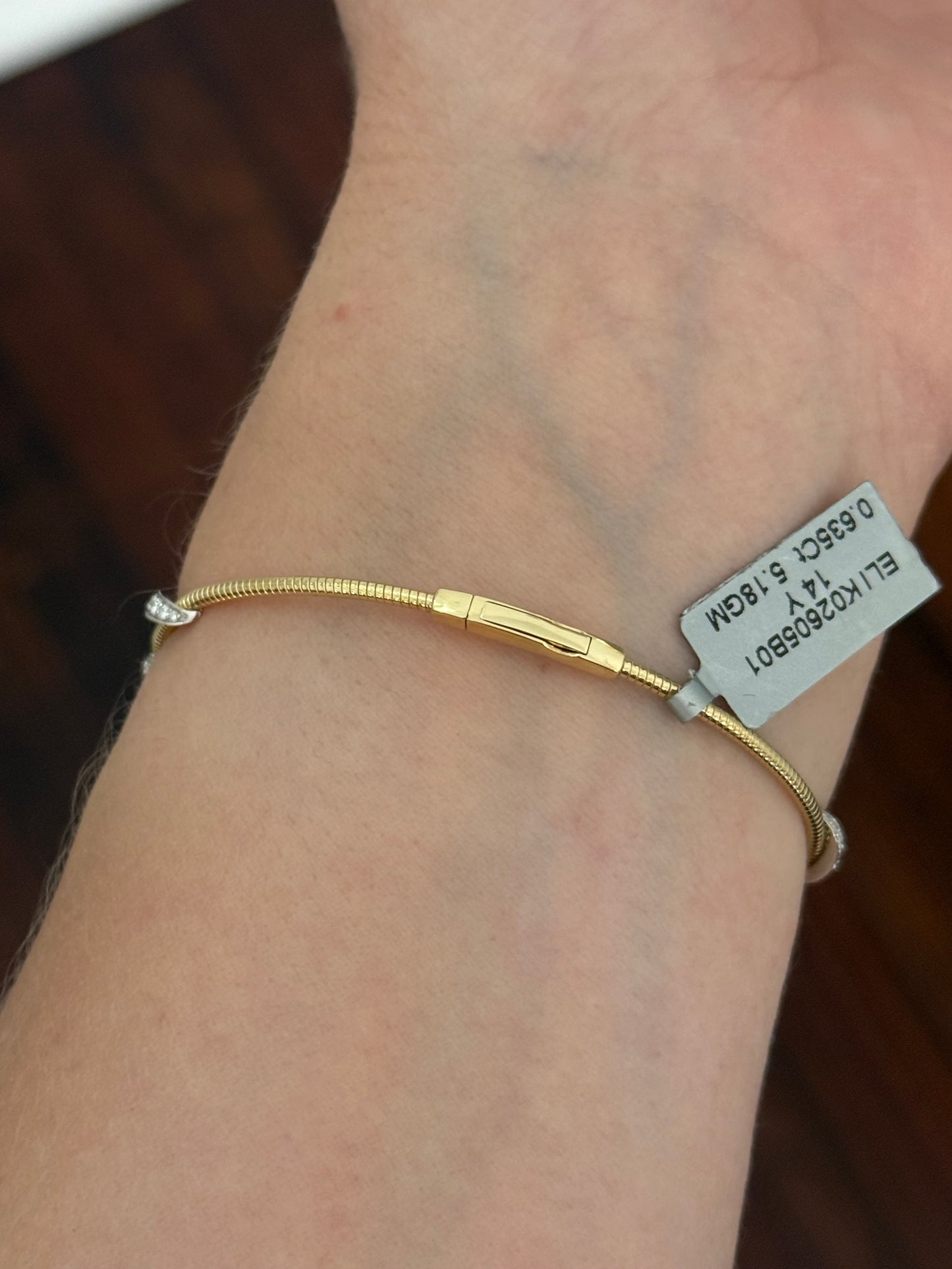 Yellow gold lab diamond flex bracelet. Lab diamonds are set in white gold.