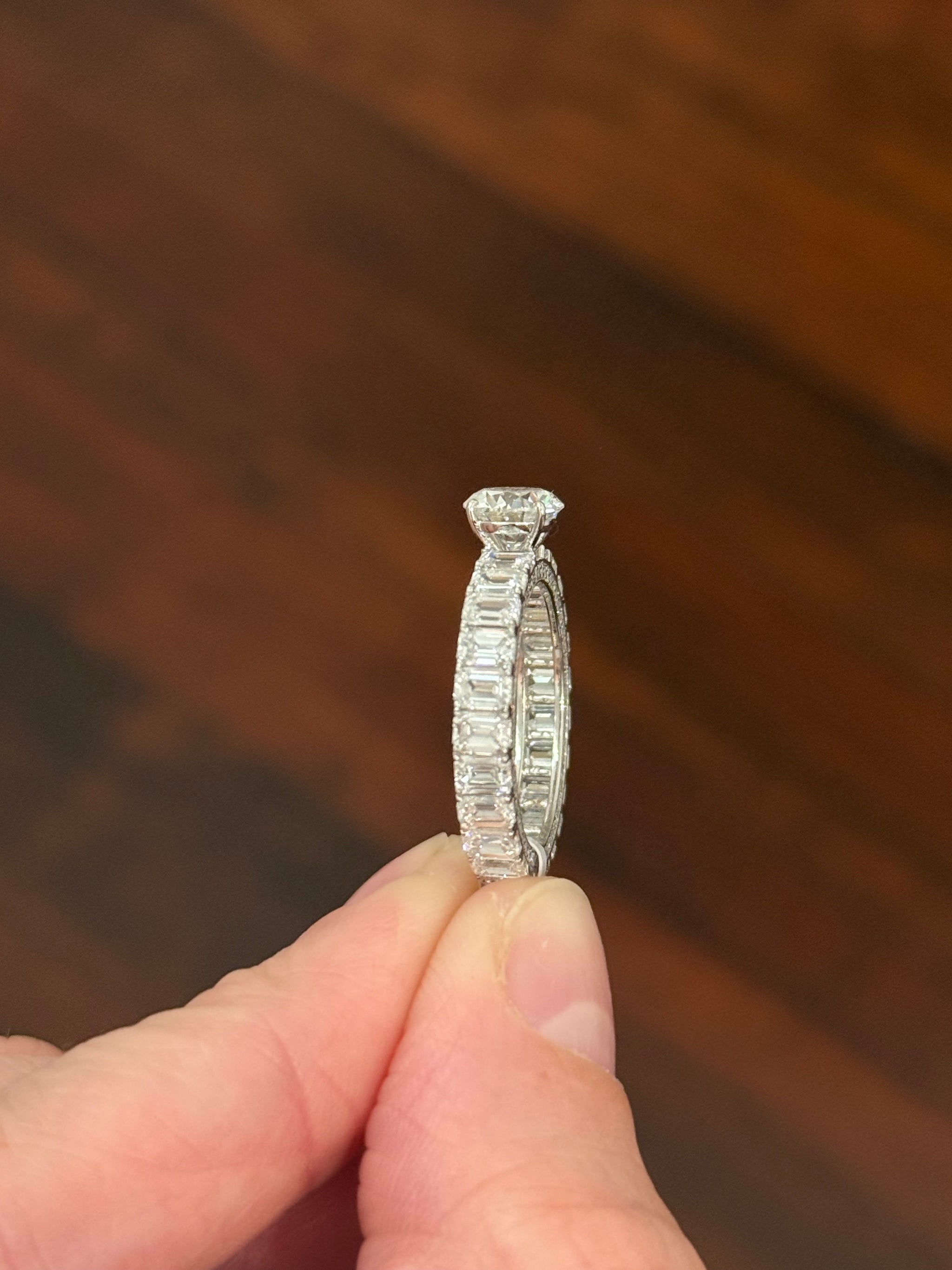White gold 1.09ct round lab diamond and 4.1ct emerald cut eternity ring