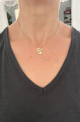 Yellow gold snake pendants
