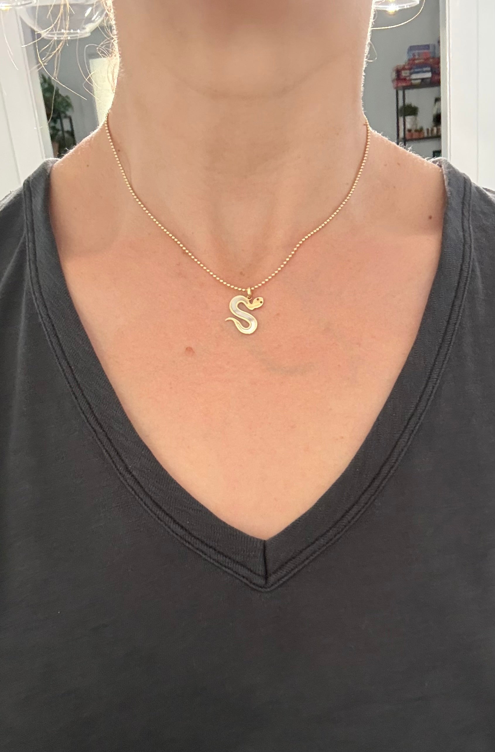 Yellow gold snake pendants