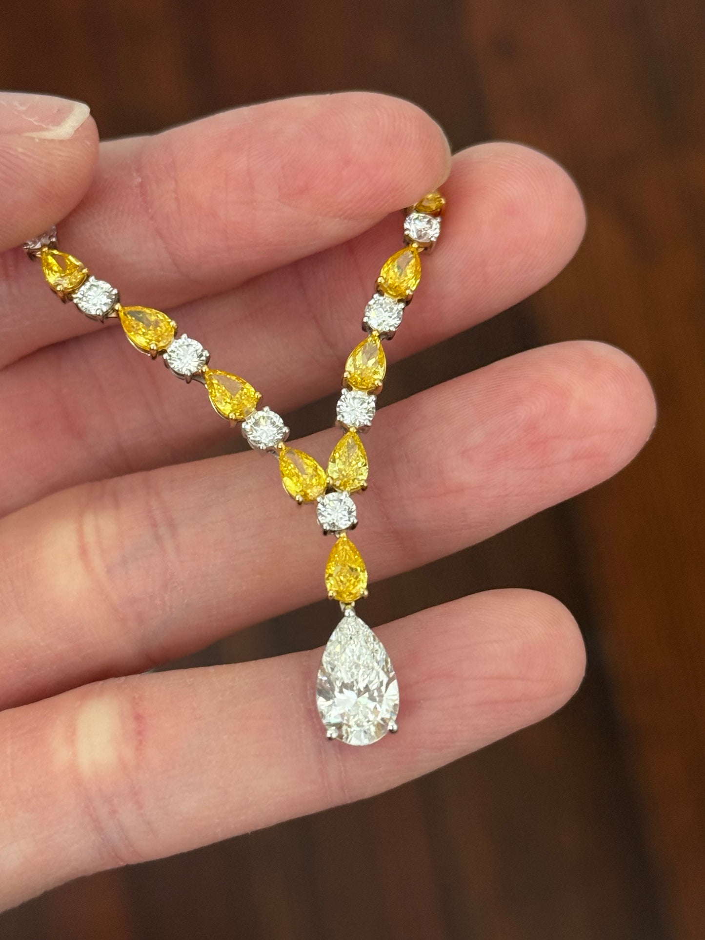 White gold pear shape yellow and white lab diamond and round white lab diamond necklace. Center stone is IGI certified and 1.86cts D VVS2