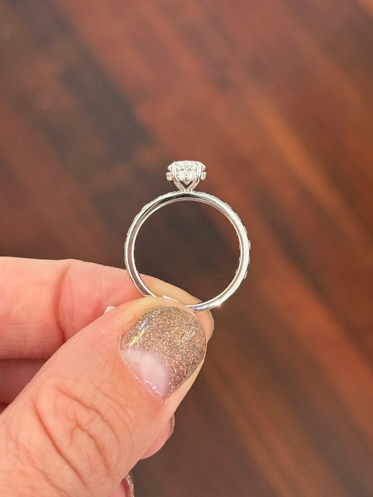 White gold oval and round lab diamond ring. Center stone is 1ct and 8.5x6mm