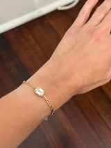 Yellow gold paperclip 3.02ct emerald cut lab diamond bracelet. Emerald cut measures 9.90x6.75mm