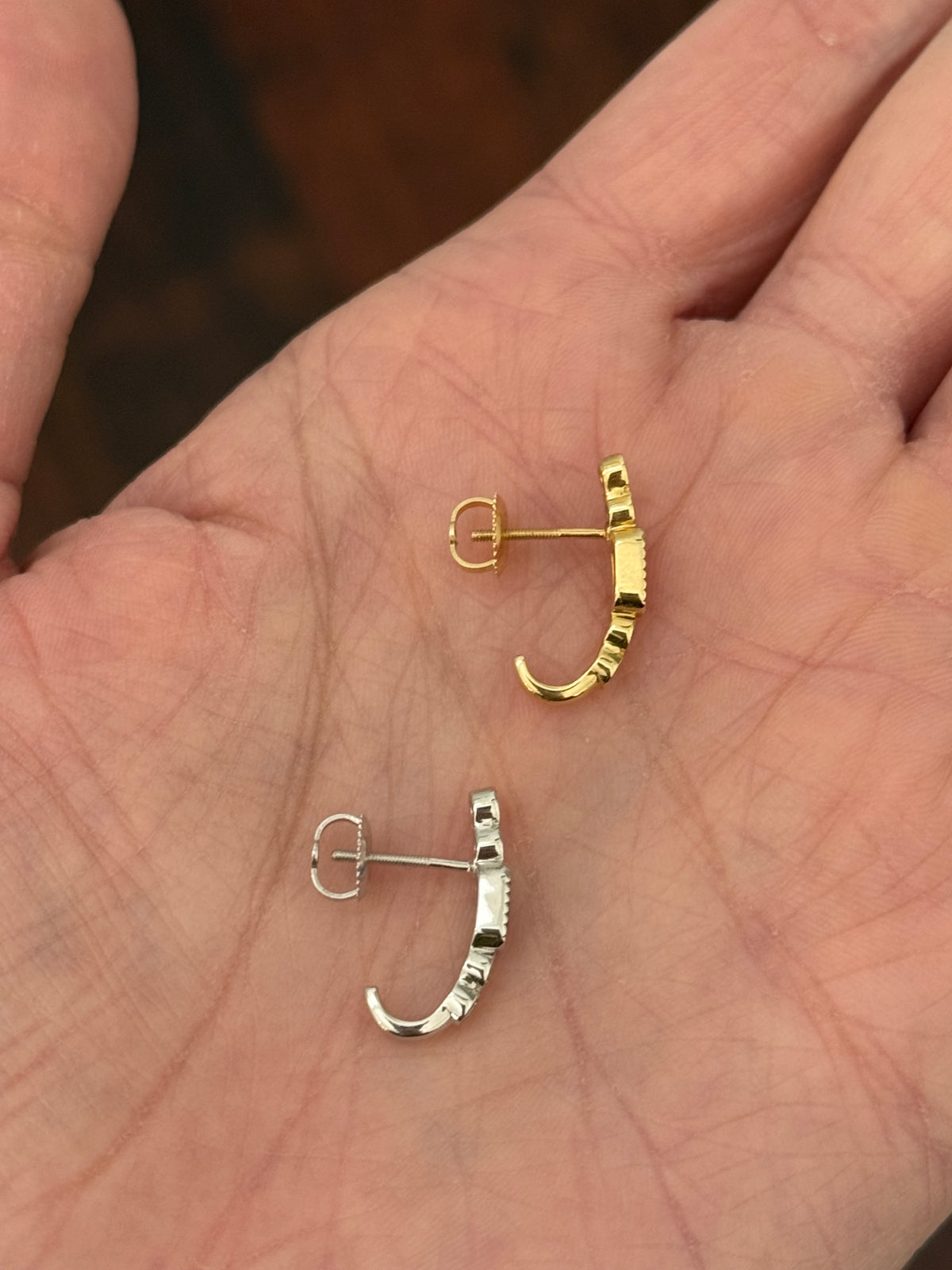 Natural diamond screw back earrings available in yellow gold with rubies and white gold with sapphires
