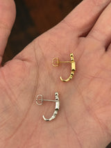 Natural diamond screw back earrings available in yellow gold with rubies and white gold with sapphires