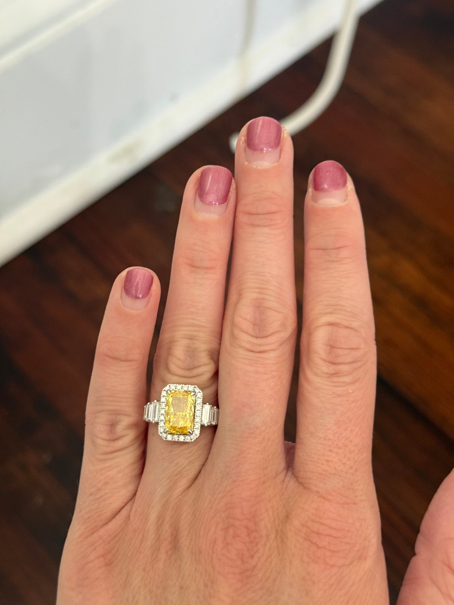 White gold radiant yellow lab diamond and baguette and round lab diamond ring
