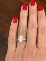 White gold oval lab diamond ring. Center stone is IGI certified and 3.03cts E VVS2