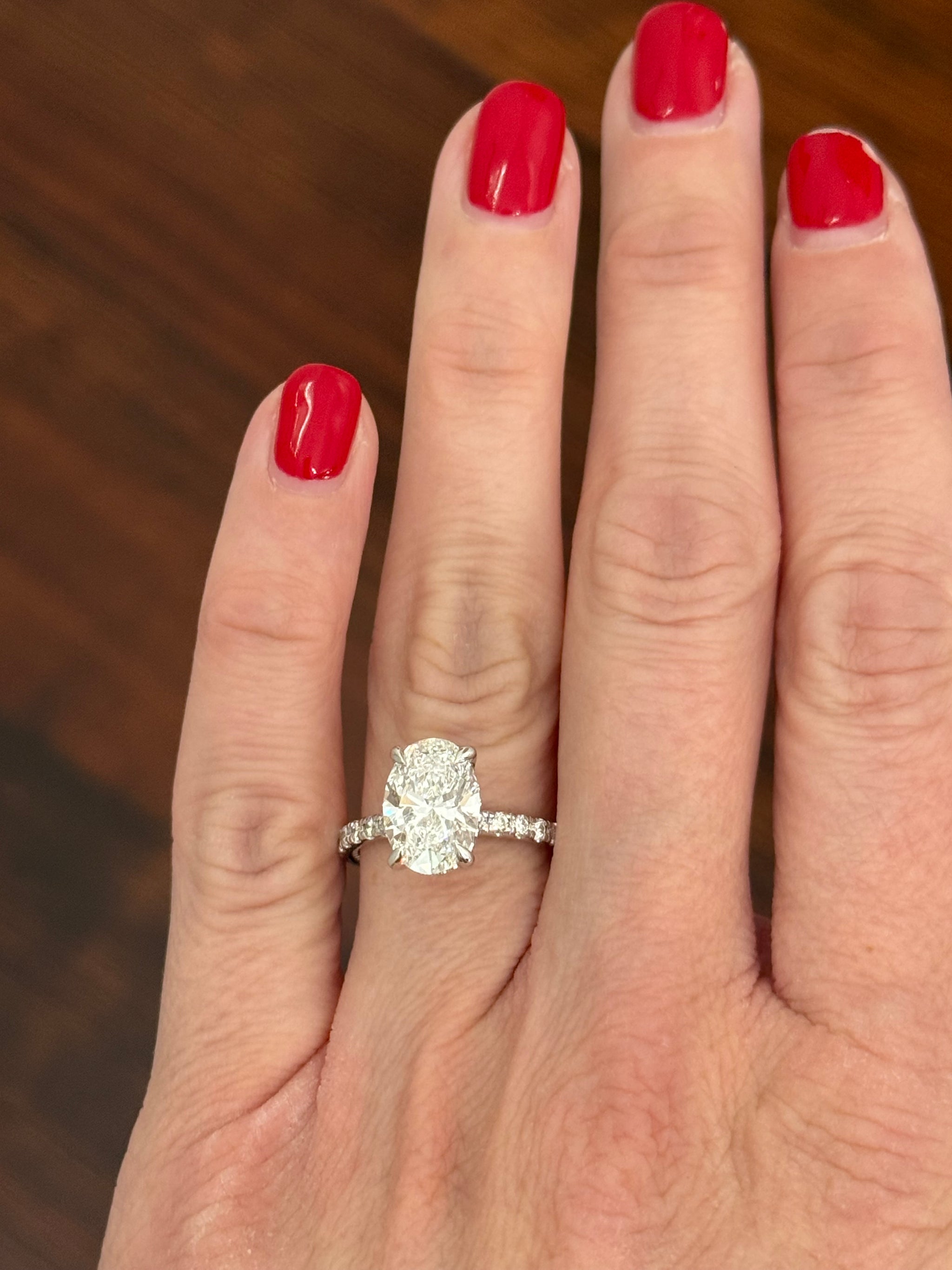 White gold oval lab diamond ring. Center stone is IGI certified and 3.03cts E VVS2