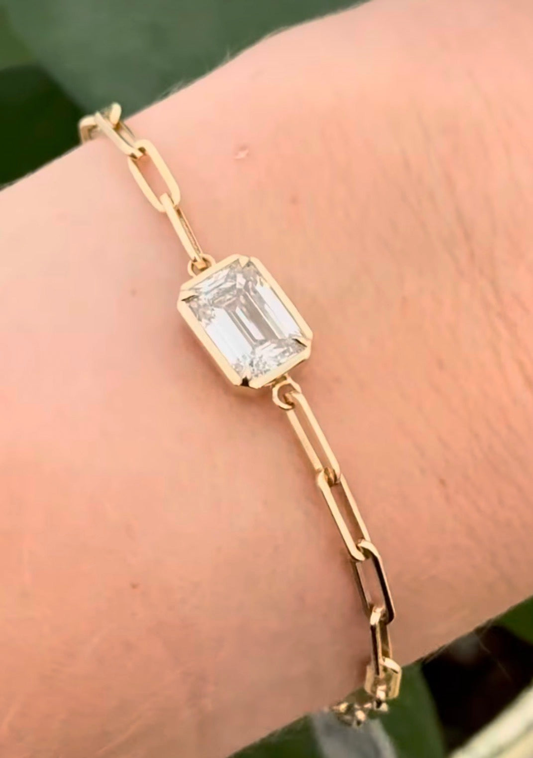Yellow gold paperclip 3.02ct emerald cut lab diamond bracelet. Emerald cut measures 9.90x6.75mm
