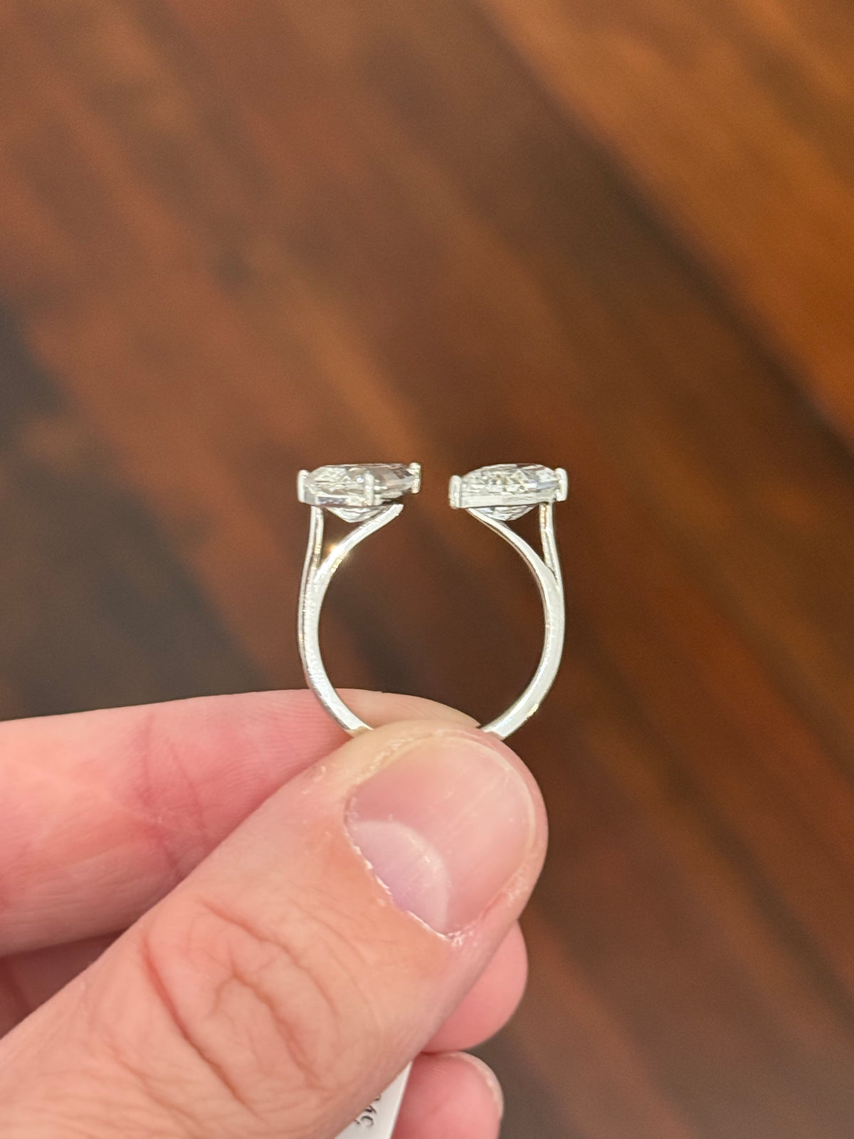 White gold 4.38ct step cut pear lab diamond bypass ring. Each measures 12.78x6.10mm