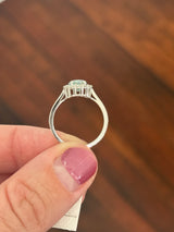 White gold oval blue lab diamond and white lab diamond ring