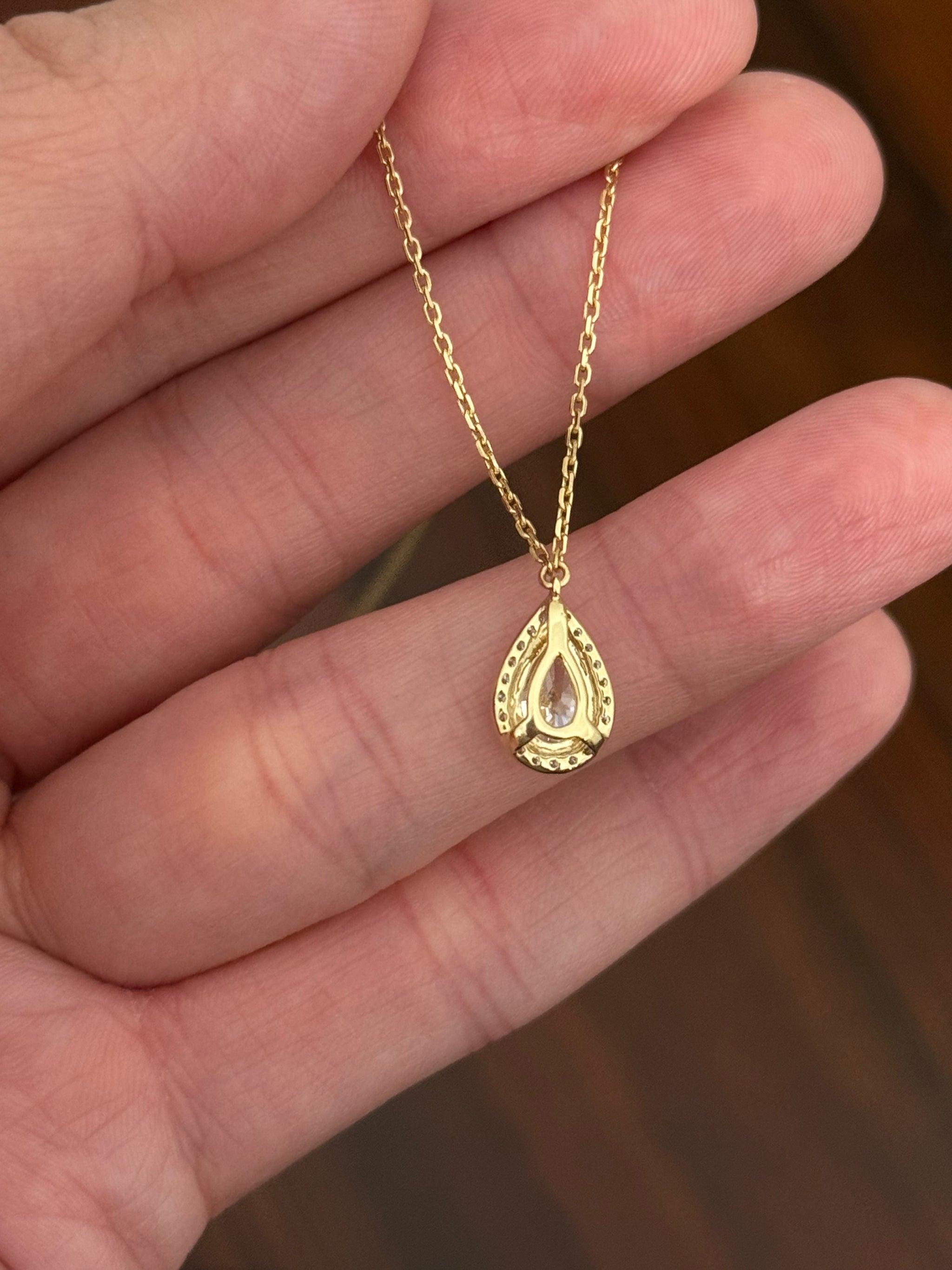 Yellow gold pear shaped lab diamond necklace. Center stone is 1.05cts and measures 8.6x5.4mm. Chain is 16” with an adjustment of 4” to make as long as 20”.